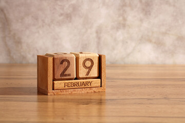 February 29, wooden calendar made of cubes. the last day of winter in leap year. winter date of...