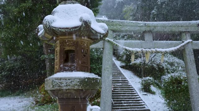 Stone Lantern and Snowy Torii Gate on Shimane Oki Islands, Japan in Winter