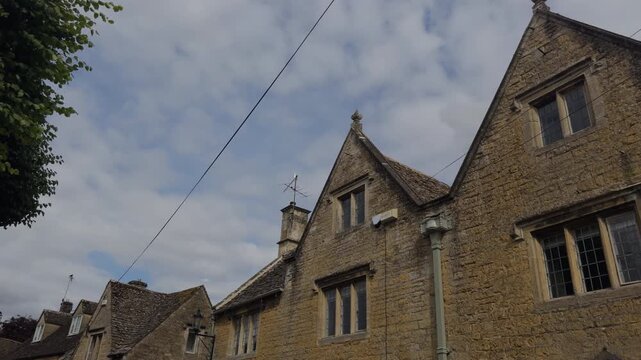 Walking through the charming stone streets of Bourton-on-the-Water Cotswolds