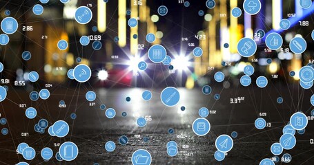 Animation of connected media and social network icons and processing data over city street at night - Powered by Adobe