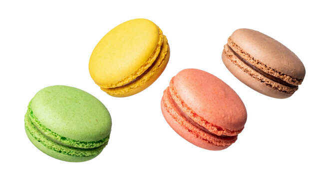four colorful macarons arranged in a playful composition against a stark transparent background, highlighting their vibrant hues and delicate textures, perfect for dessert and confectionery themes.