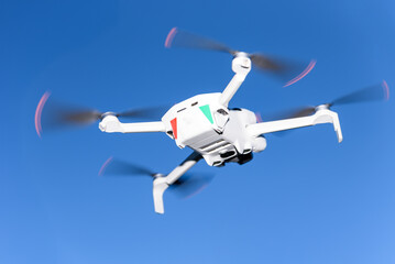 Flying Drone Against Blue Sky