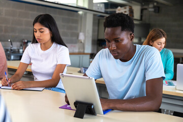 Diverse university students studying in a modern classroom