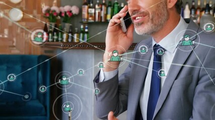 Animation of network of connections over caucasian businessman talking on smartphone