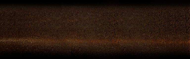 Panoramic dark luxury background featuring fine golden granules on black surface. Elegant shimmering sand texture ideal for premium branding horizontal banners and festive backdrop designs