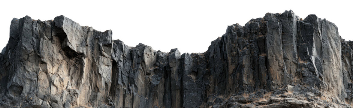 A jagged, gray rock formation with a detailed texture and an uneven, eroded crest