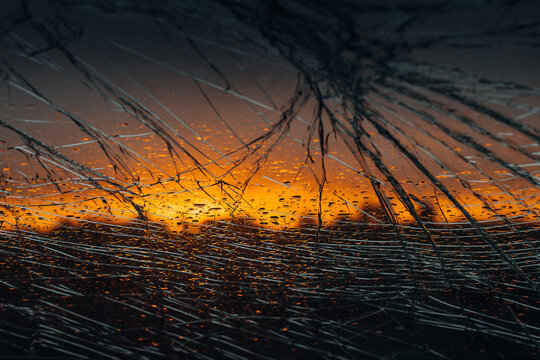 Shattered Car Windshield from Traffic Accident Crash at sunset