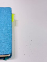 blue notebook on a white background.