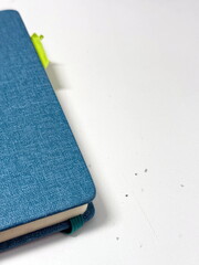 blue notebook on a white background.