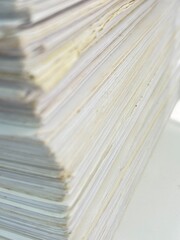 Piles of old papers were stacked on top of each other.