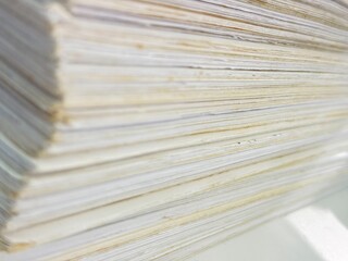 Piles of old papers were stacked on top of each other.