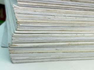 Piles of old papers were stacked on top of each other.