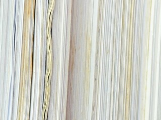 Piles of old papers were stacked on top of each other.