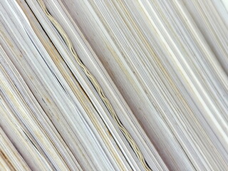 Piles of old papers were stacked on top of each other.