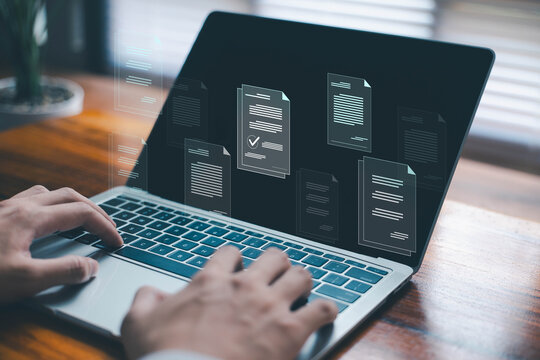 Businessman review digital documents on a laptop. representing online document management, verification workflow, file processing, and organized digital paperwork. document file electronic