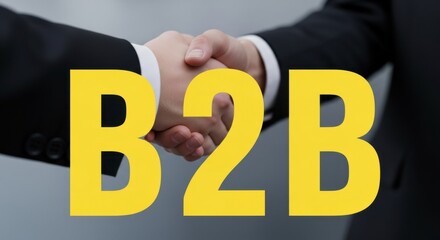 Business partnership handshake with B2B concept in modern setting