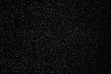 Texture of black foam plastic.