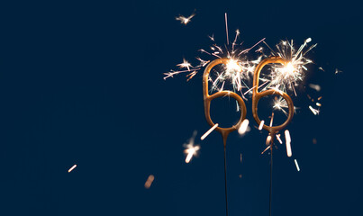 66 years anniversary celebration festive background made with Bengal fires in the form of number Sixty six.