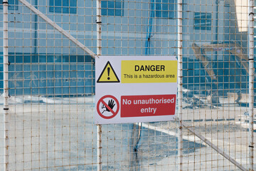 Danger Warning Sign on Construction Site Safety Fence