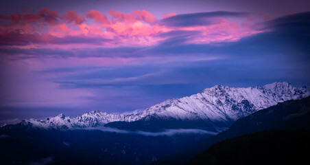 Spectacular sunset panorama of snow-capped mountains, Austria