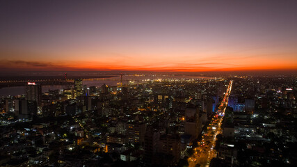 Aerial view of the city lights illuminating the skyline under the fading glow of the sunset, Maputo, Cidade de Maputo, Mozambique.