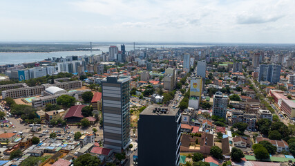 Aerial view of the city's skyscrapers and vibrant urban sprawl, with a distant bridge hinting at further horizons, Maputo, Cidade de Maputo, Mozambique.