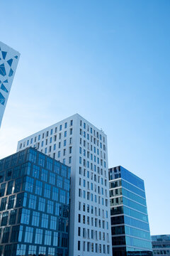 Modern urban office complex architecture with corporate facade windows, bright sky and strong perspective for business headquarters and finance themes