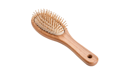A wooden hairbrush with natural bristles isolated on transparent background cut out