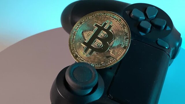 Bitcoin. Game console joystick. Slow motion video. High quality 4K footage