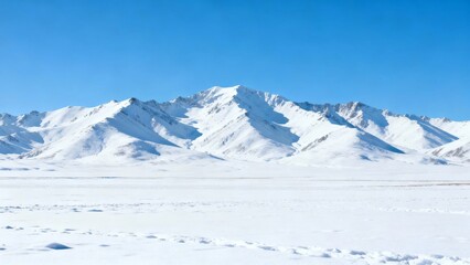 Snow-covered mountain range under clear blue sky in a vast polar landscape
