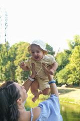 Mother and Baby Enjoying a Sunny Day in the Park Portrait