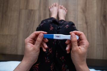 Positive Pregnancy Test in Hand Copy Space