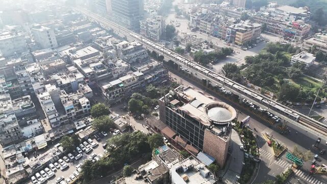 Aerial view of Noida shrouded in dense smog, where rows of residential blocks fade into the haze, illustrating severe air pollution and reduced visibility across the city.