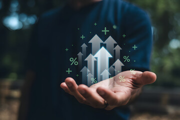 Man presenting a bunch of white arrows with plus and percent symbols floating in air