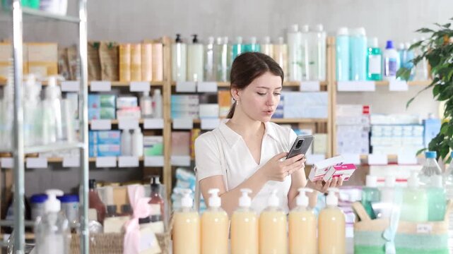 Girl scans code on package of paracetamol pills to check the expiration date. High quality 4k footage