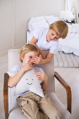 Boy children have fun covering their eyes with their hands