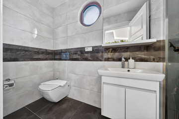 Modern Bathroom Serenity: A contemporary bathroom exudes a sense of tranquility with its clean lines, minimalist design, and an emphasis on functionality and aesthetics.