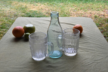 Glassware and fruits on table