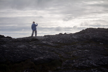 woman standing on top of the mountain in Northern Ireland
