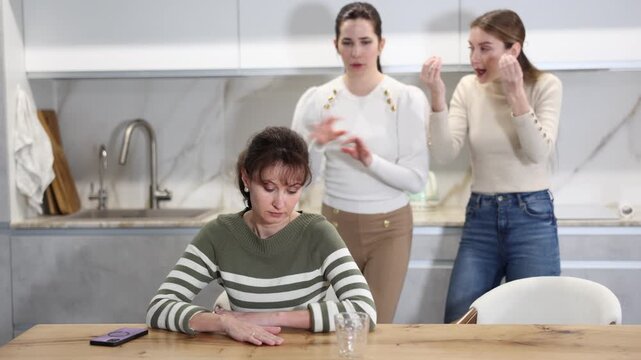 Two women swear at girl. Mom and sister scold young girl for unsuccessful studies at university. Complex intergenerational relationships 