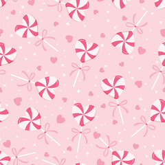Seamless pattern with heart-shaped peppermint lollipops, bows, tiny hearts and star on pink background. Sweet vector illustration for Valentine's Day.