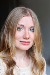Natural beauty portrait of young woman with soft makeup and clear skin in gentle daylight