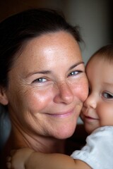 Mother and baby sharing tender moment, expressing love and family bond