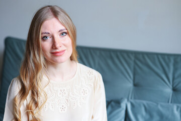 Close up portrait of smiling woman with blue eyes calm expression and natural feminine look