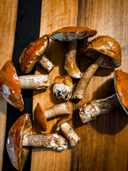 Healthy eating concept, mushroom season, redhead, a mushroom of the genus Leccinum in a loft-style kitchen, edible mushrooms for cooking, diet. High quality photo