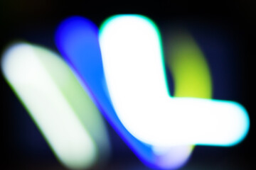Abstract Neon Light Blur - Colorful Defocused Motion in Blue, Green, and White Blurred shine lights for overlay effect.