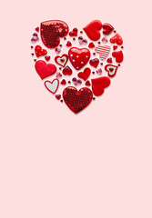 Heart-Shaped Arrangement of Red Decorations on Pink Background for Valentine's Day