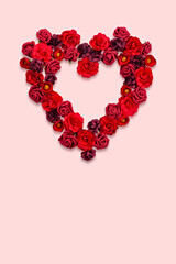 Heart-Shaped Rose Arrangement on Soft Pink Background for Romantic Occasions