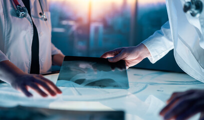 two medical professionals interacting with touch screen