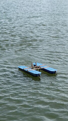 Paddle wheel aerator used to circulate the water, preventing stagnation and distributing oxygen evenly throughout the lake